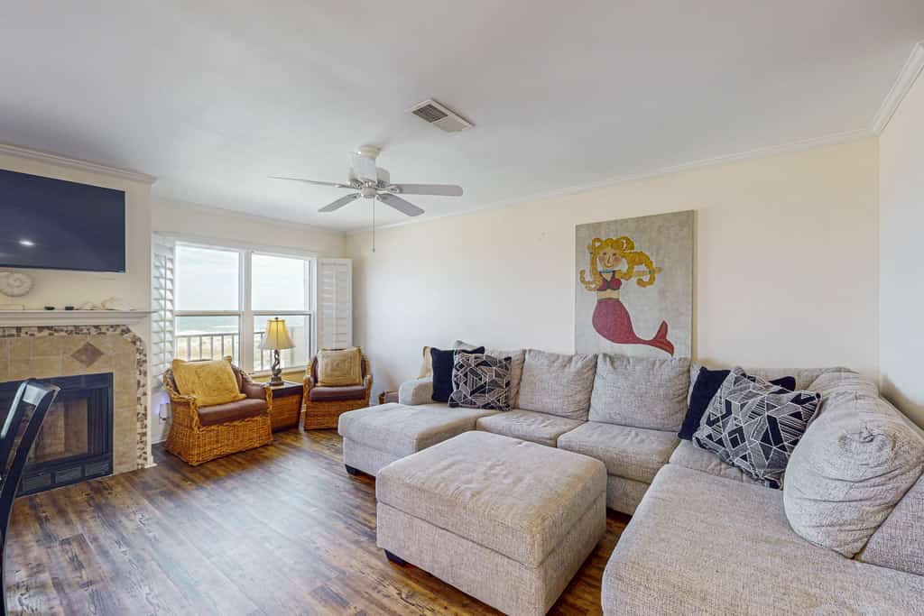 Oceanfront townhome with a furnished balcony, outdoor pool, & tennis