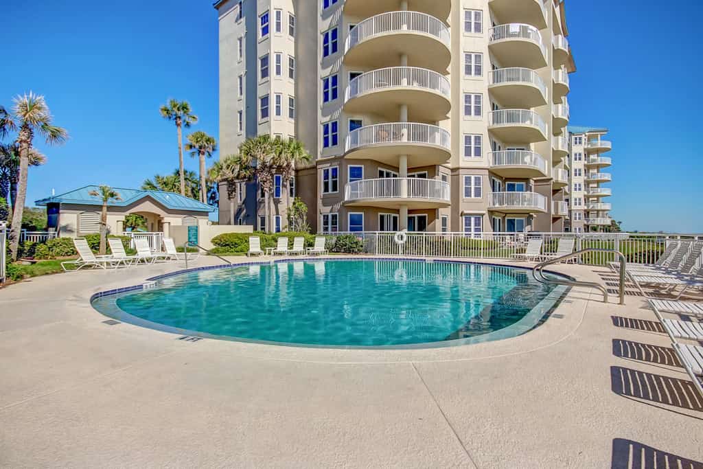 Elegant, oceanfront condo with balcony, washer/dryer & on-site pool
