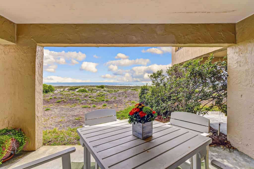 Beachfront condo with outdoor pool, patio & washer/dryer - dog-friendly