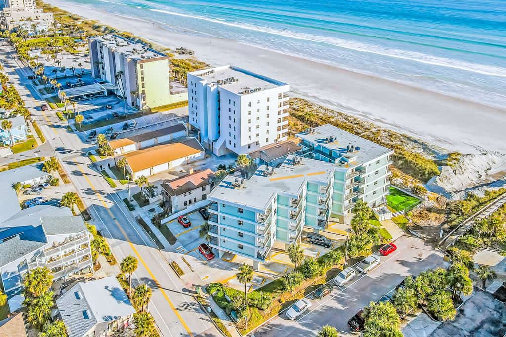 Polished oceanfront condo with pool access, private balcony & washer/dryer