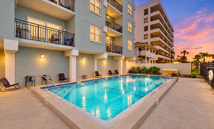 Polished oceanfront condo with pool access, private balcony & washer/dryer