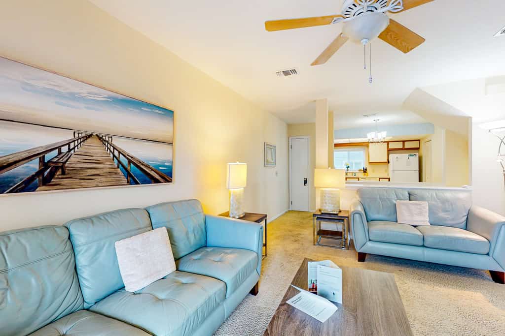 Ocean-view townhome with balcony & W/D - walk to beach - dog-friendly