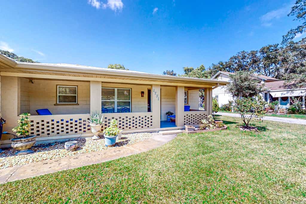 Home near the beach & golf with inviting patio, fireplace, AC, & washer/dryer