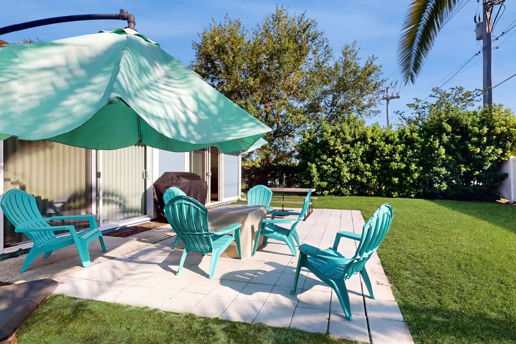 Water-view dog-friendly home with outdoor space & entertainment options