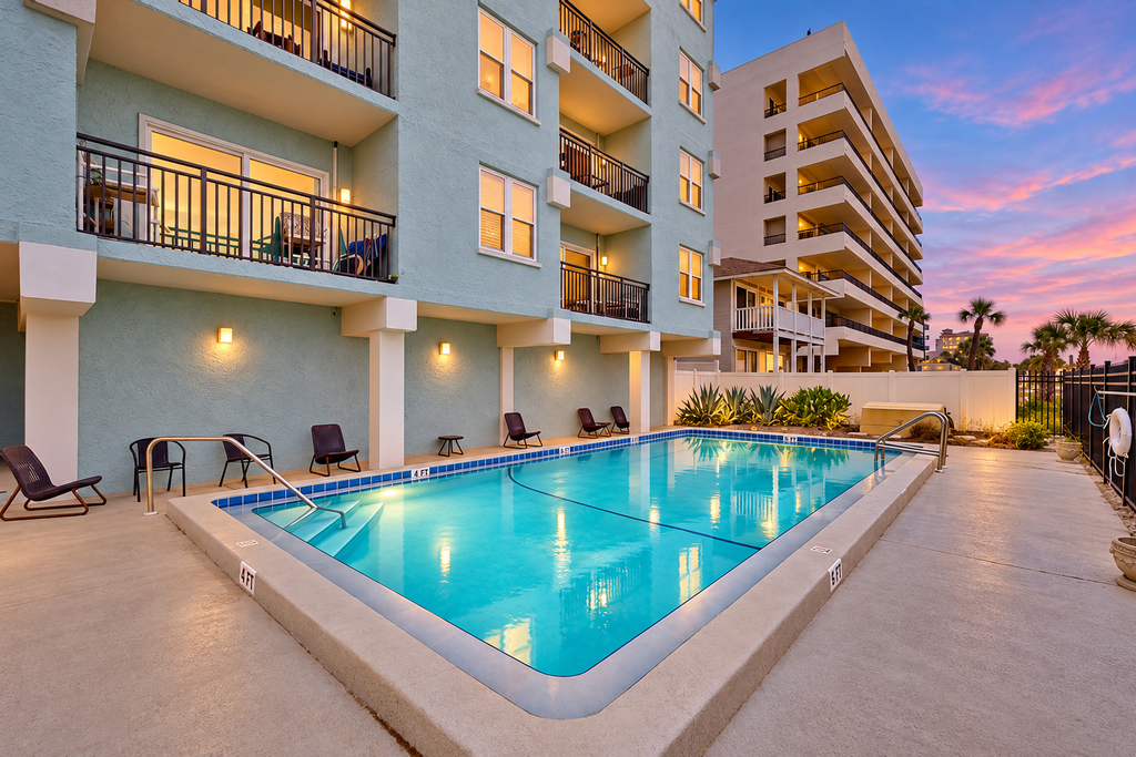 Modern oceanfront condo with outdoor pool, balcony, & washer/dryer