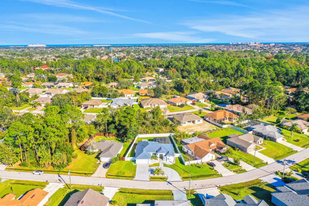 Contemporary coastal escape with heated pool, fenced yard, & outdoor dining
