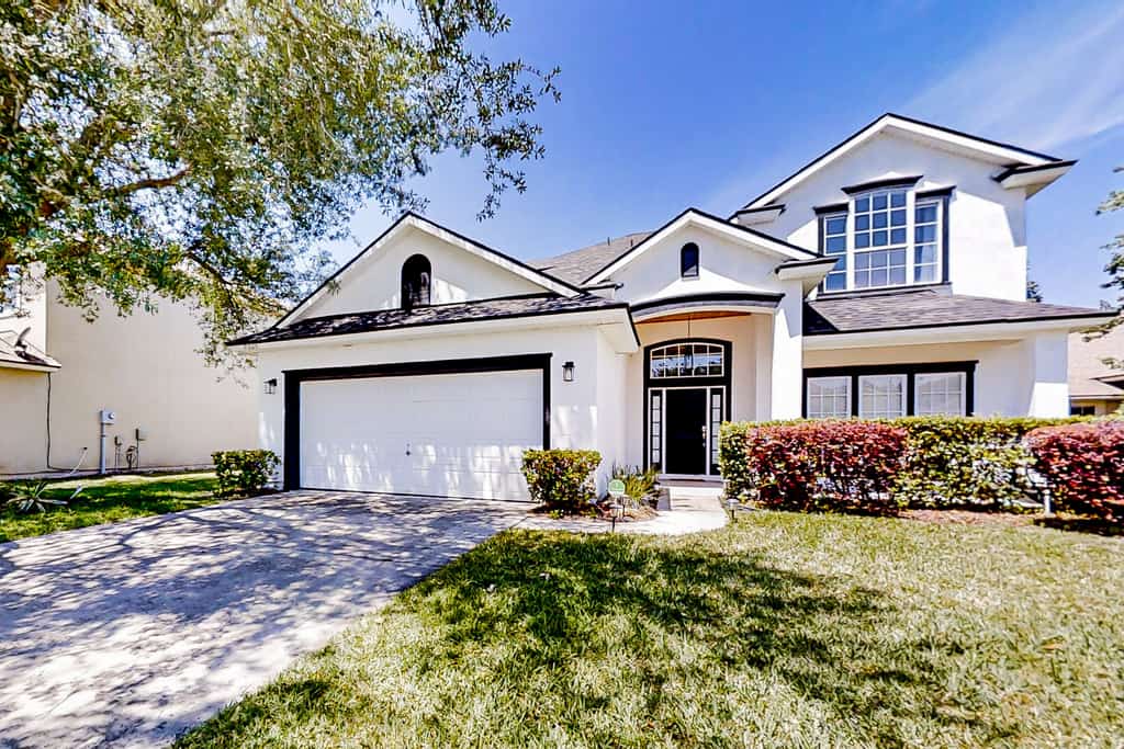 Waterfront 2-story home with water views, patio, streaming, washer/dryer, & AC