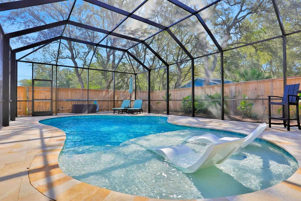 Renovated home with private pool, patio, outdoor fireplace, & grill