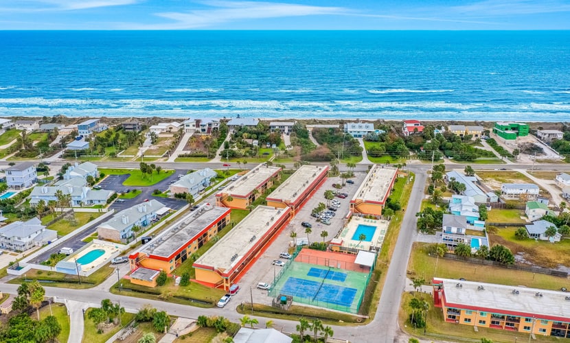 Ground-floor condo by the beach with on-site pool, tennis, & private patio