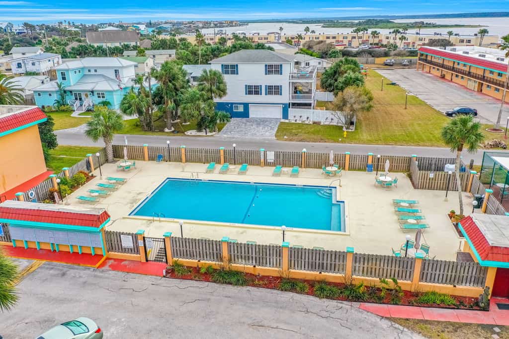 Ground-floor condo by the beach with on-site pool, tennis, & private patio