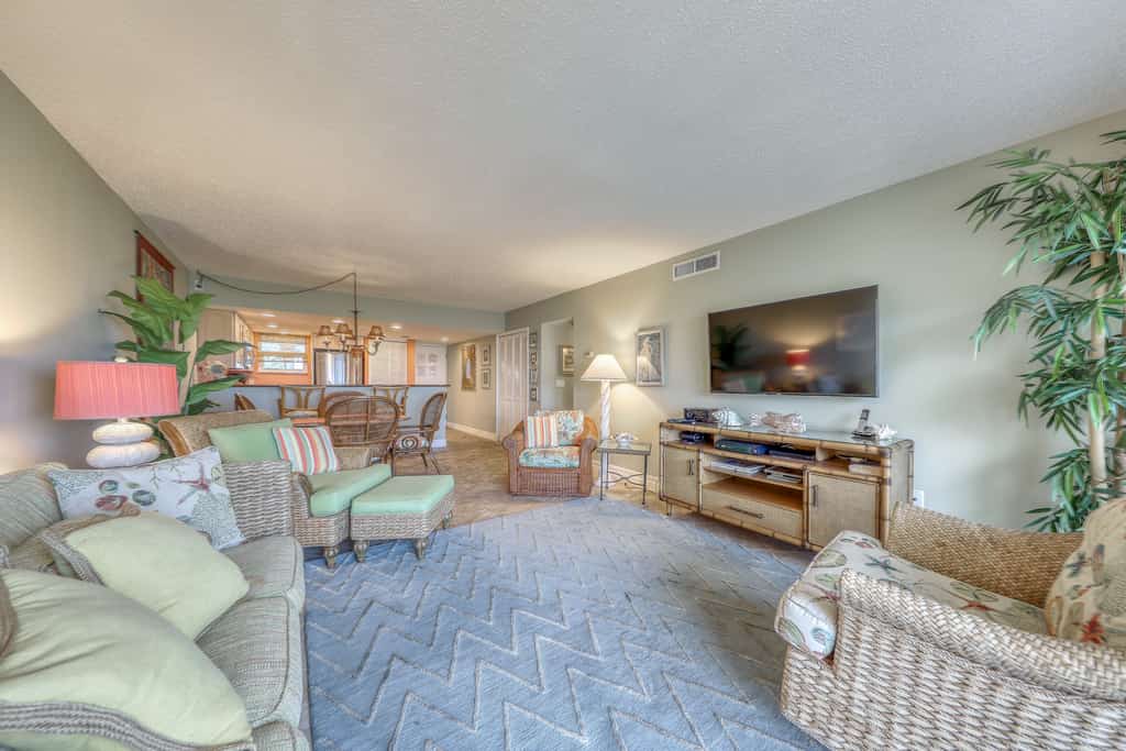Island-themed living with furnished patio, shared pool & beach access