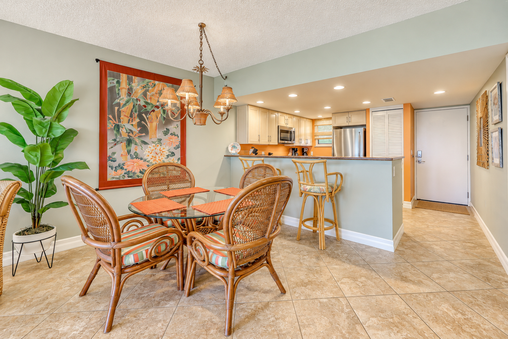 Island-themed living with furnished patio, shared pool & beach access