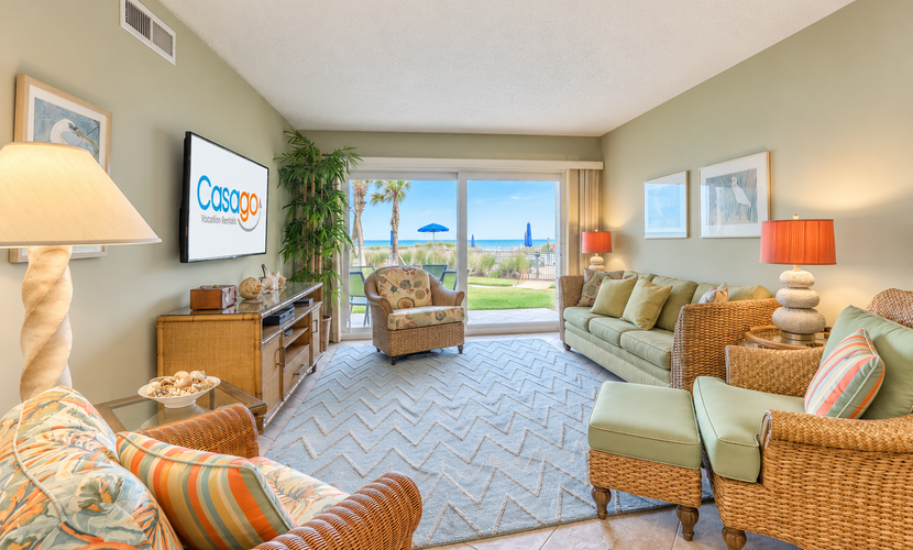 Island-themed living with furnished patio, shared pool & beach access