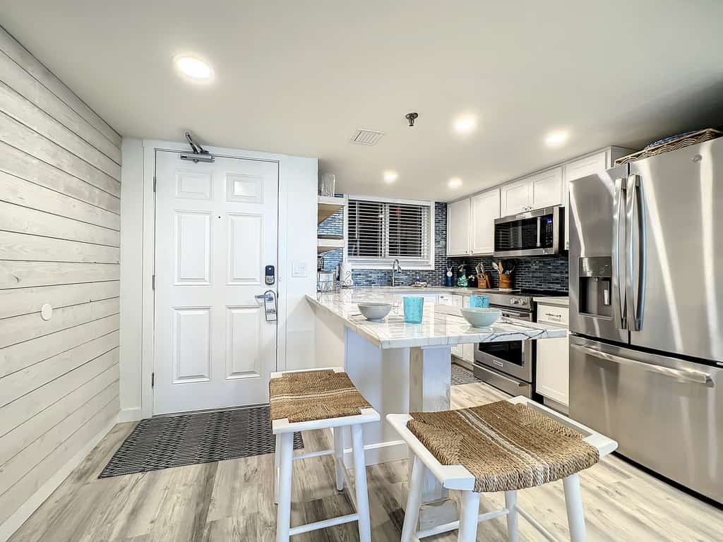 Bright 2BR beachfront condo with balcony, pool & ocean views