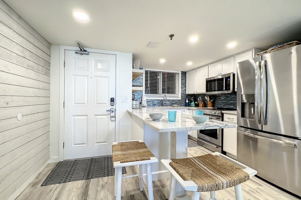 Bright 2BR beachfront condo with balcony, pool & ocean views