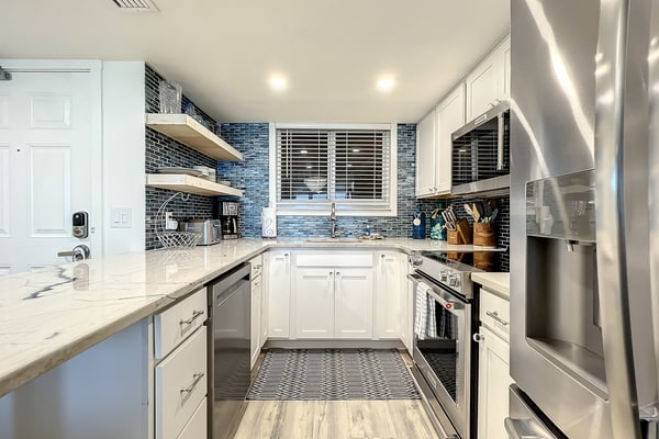 Bright 2BR beachfront condo with balcony, pool & ocean views