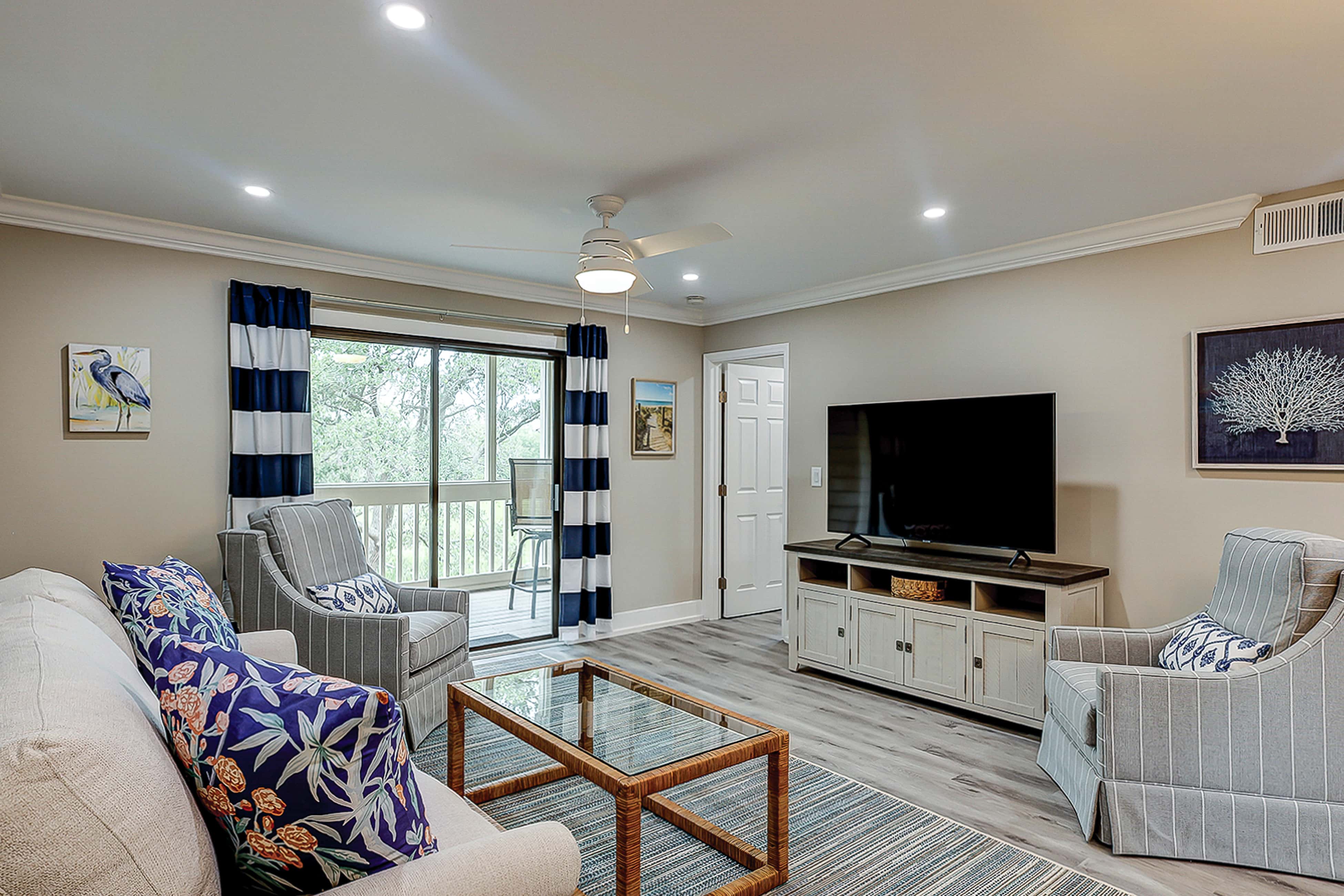 Fully updated condo with serene view, enclosed balcony, WiFi, W/D, pool, & gym
