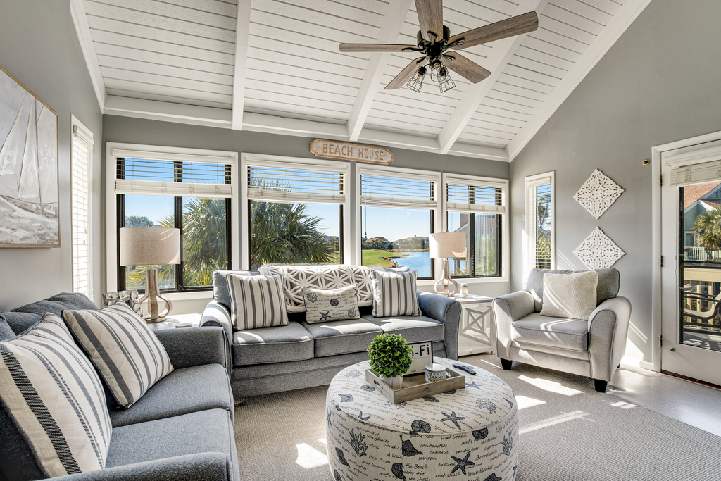 Stylish beach villa with three decks, and golf course views