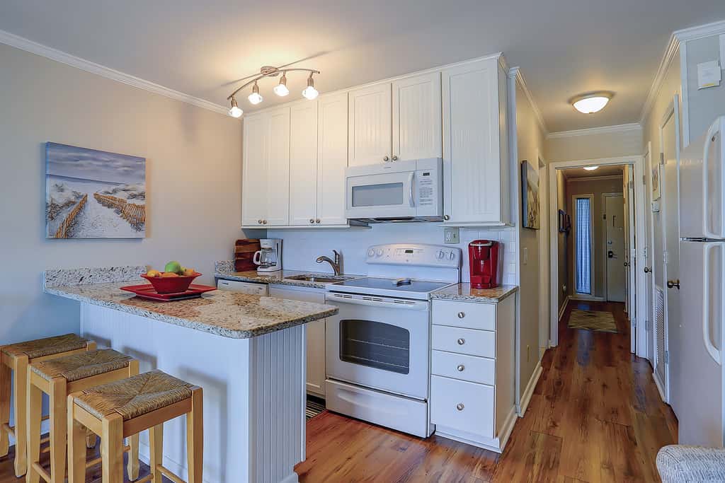 Beachfront condo with pool, beach access, pier, private balcony, & central AC