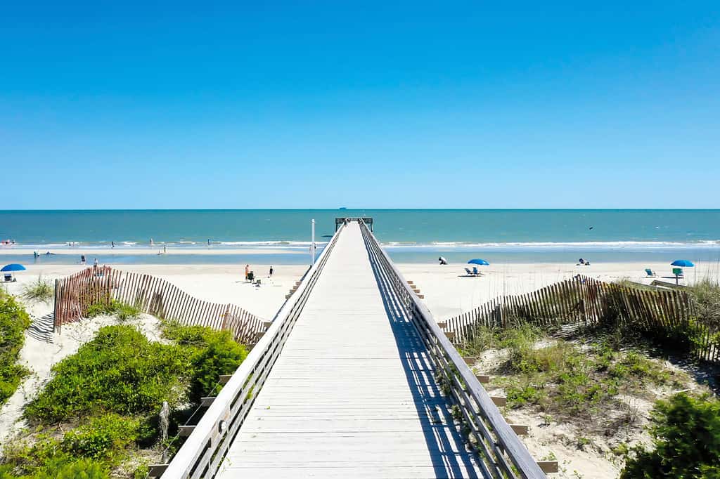 Beachfront condo with pool, beach access, pier, private balcony, & central AC