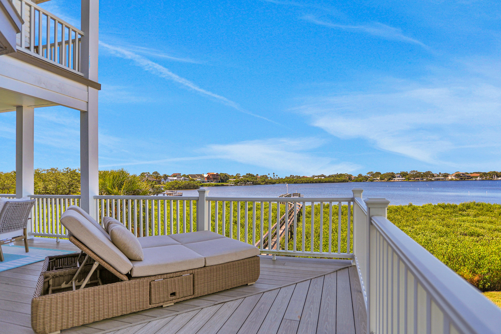 Luxurious waterfront home with pool game room dock