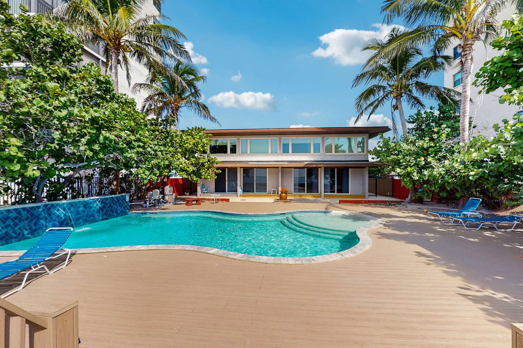 Beachfront condo with pool and island vibes