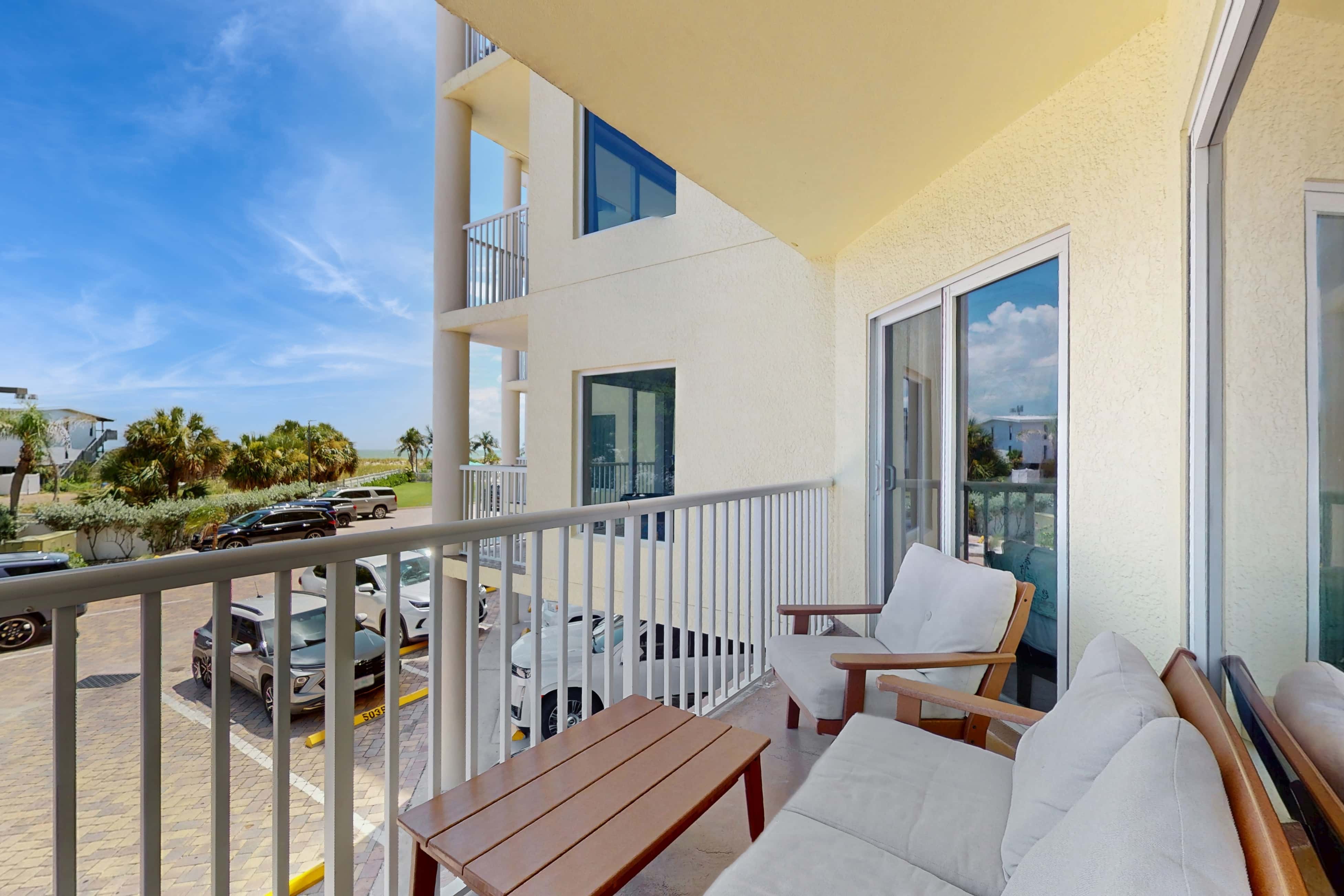 Second floor condo with beach access balcony pool hot tubs and ping pong