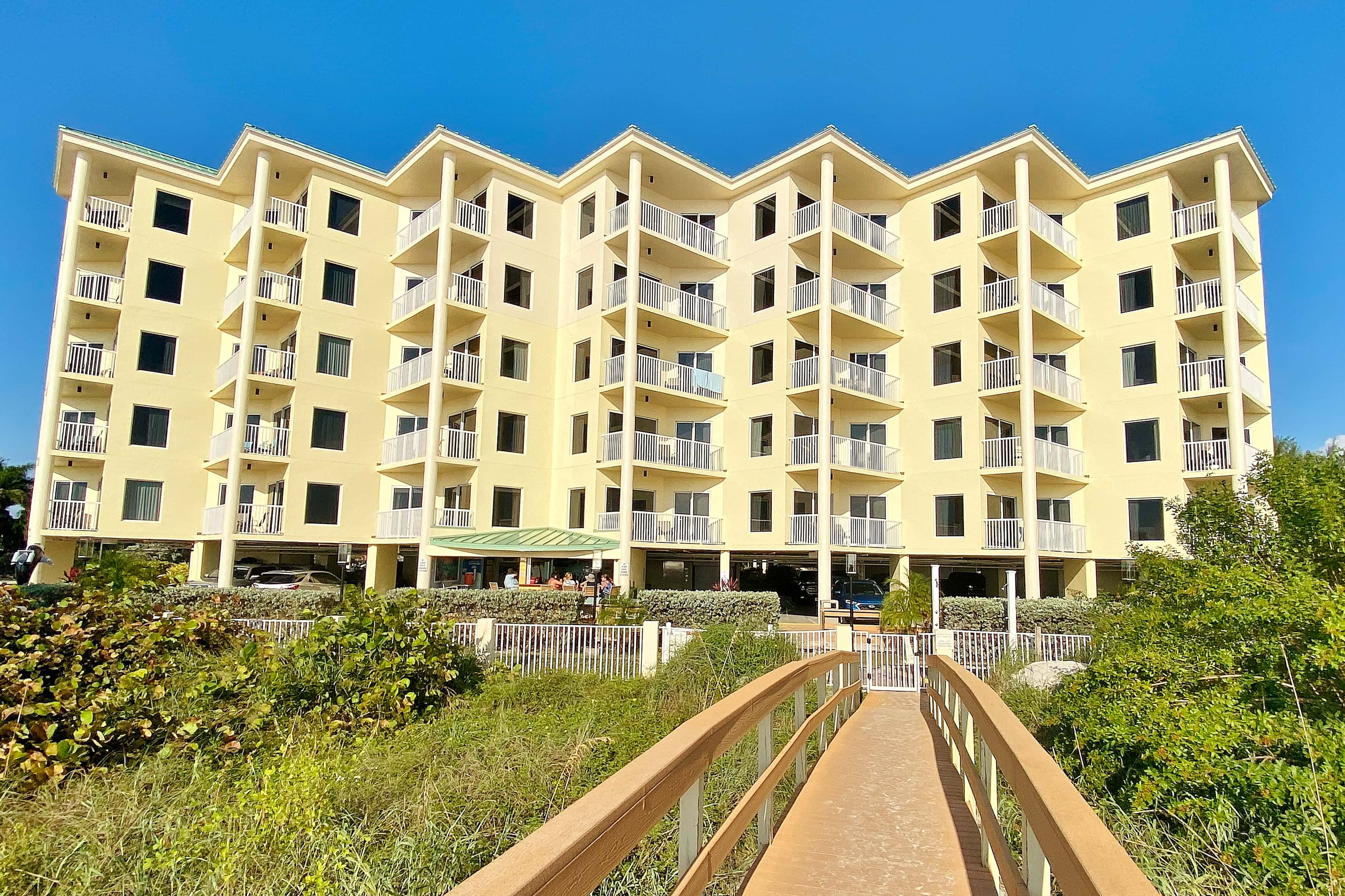 Second floor condo with beach access balcony pool hot tubs and ping pong