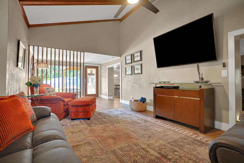Riverfront retreat with pool spa outdoor kitchen firepit dock sauna and games