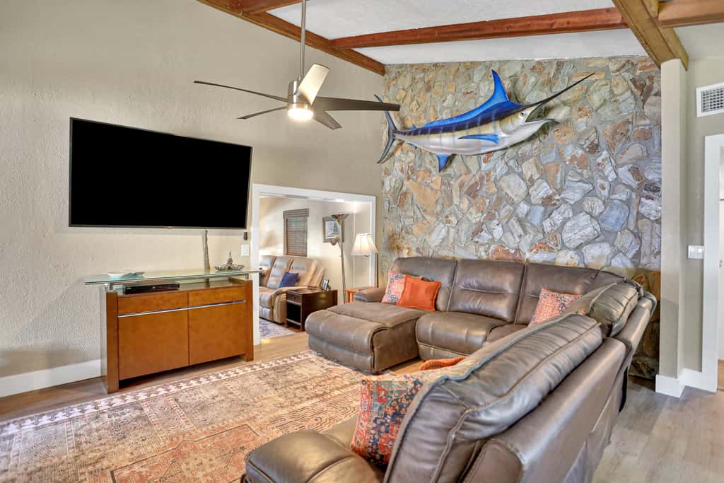 Riverfront retreat with pool spa outdoor kitchen firepit dock sauna and games