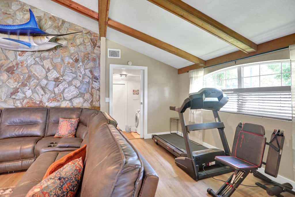 Riverfront retreat with pool spa outdoor kitchen firepit dock sauna and games