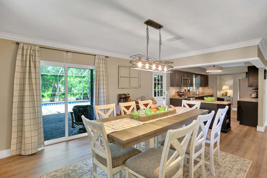 Riverfront retreat with pool spa outdoor kitchen firepit dock sauna and games