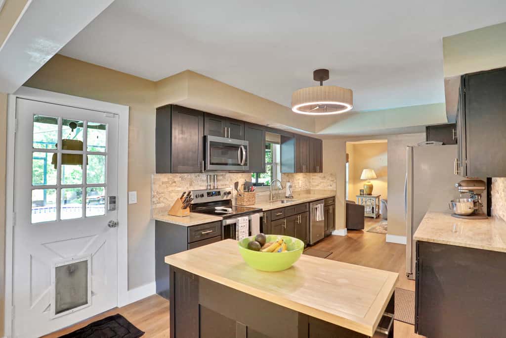 Riverfront retreat with pool spa outdoor kitchen firepit dock sauna and games