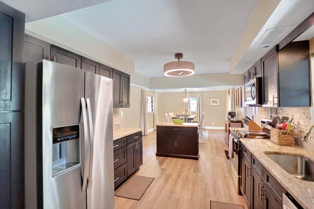 Riverfront retreat with pool spa outdoor kitchen firepit dock sauna and games