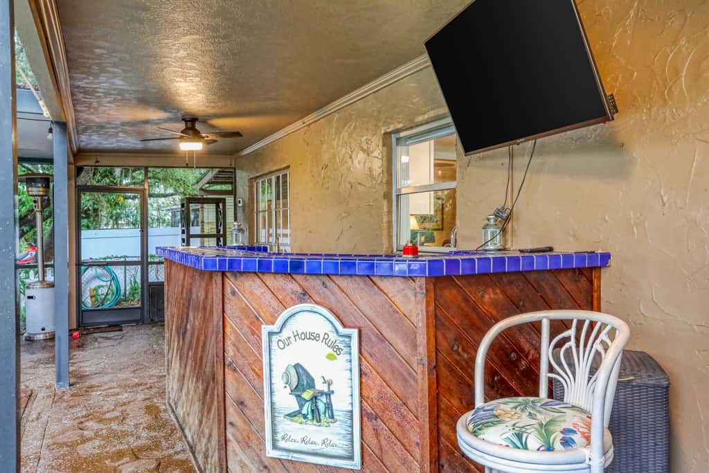 Riverfront retreat with pool spa outdoor kitchen firepit dock sauna and games