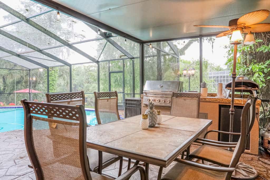 Riverfront retreat with pool spa outdoor kitchen firepit dock sauna and games