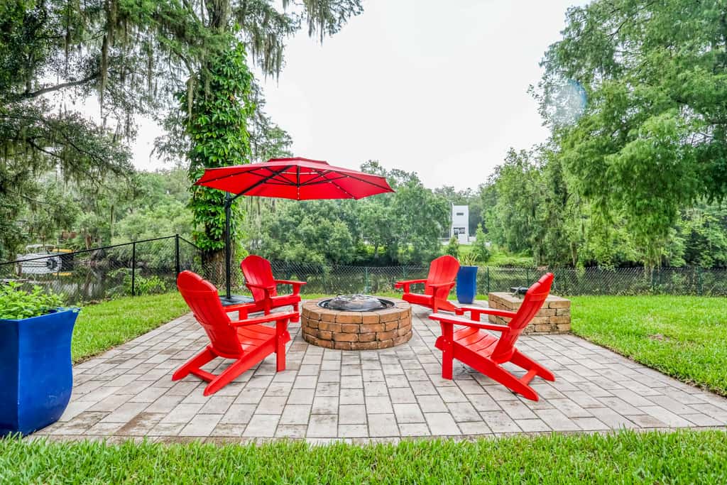Riverfront retreat with pool spa outdoor kitchen firepit dock sauna and games
