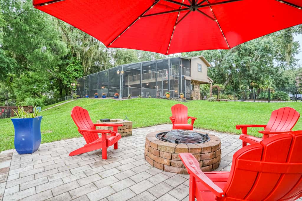 Riverfront retreat with pool spa outdoor kitchen firepit dock sauna and games