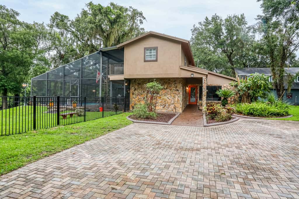 Riverfront retreat with pool spa outdoor kitchen firepit dock sauna and games