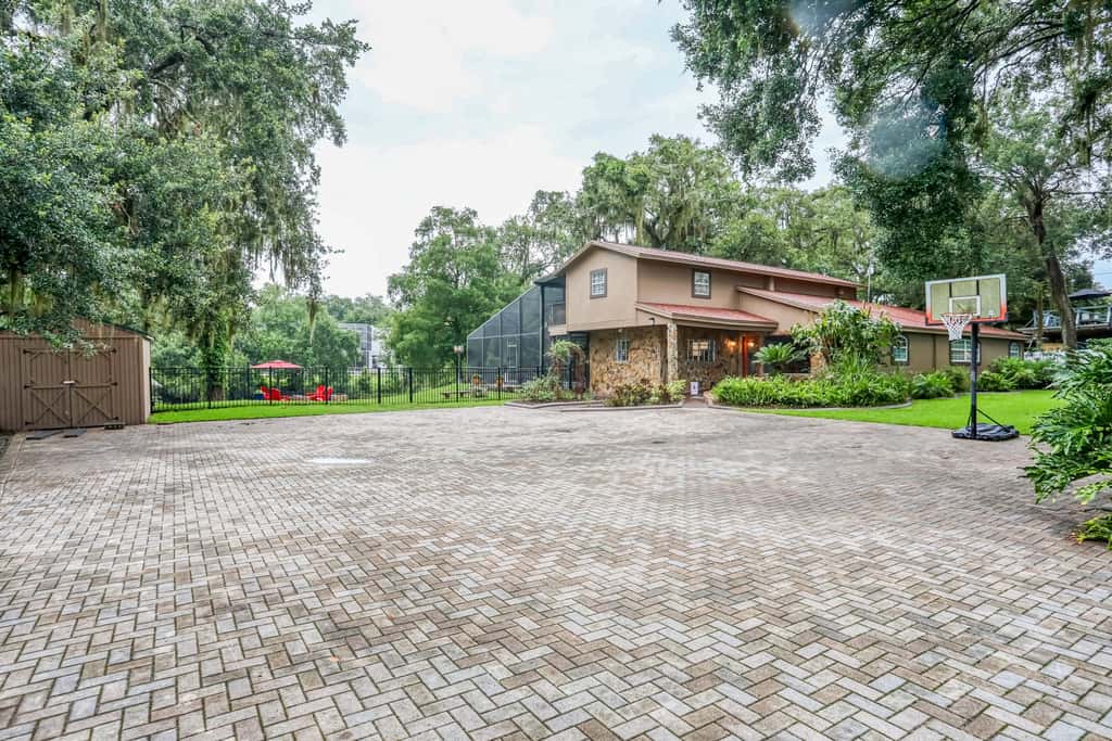 Riverfront retreat with pool spa outdoor kitchen firepit dock sauna and games