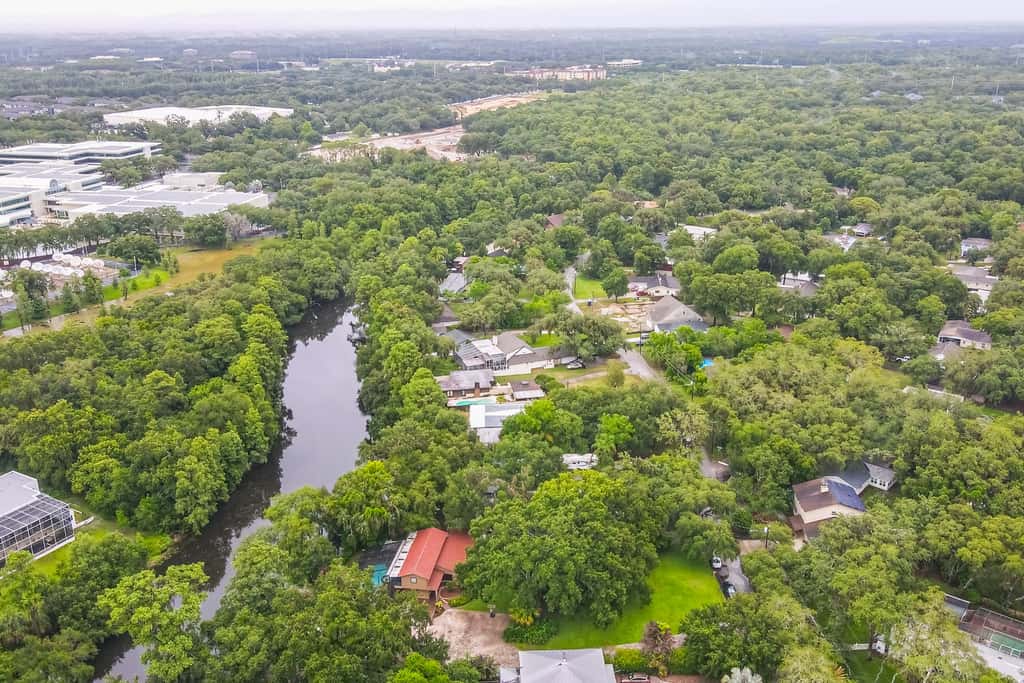 Riverfront retreat with pool spa outdoor kitchen firepit dock sauna and games