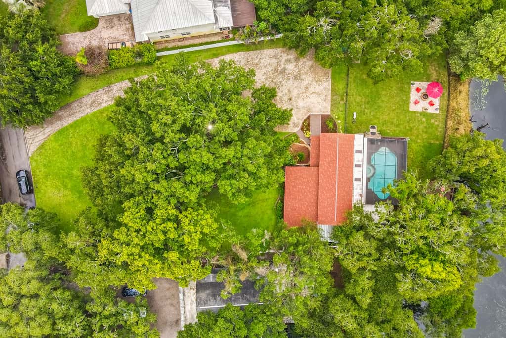 Riverfront retreat with pool spa outdoor kitchen firepit dock sauna and games
