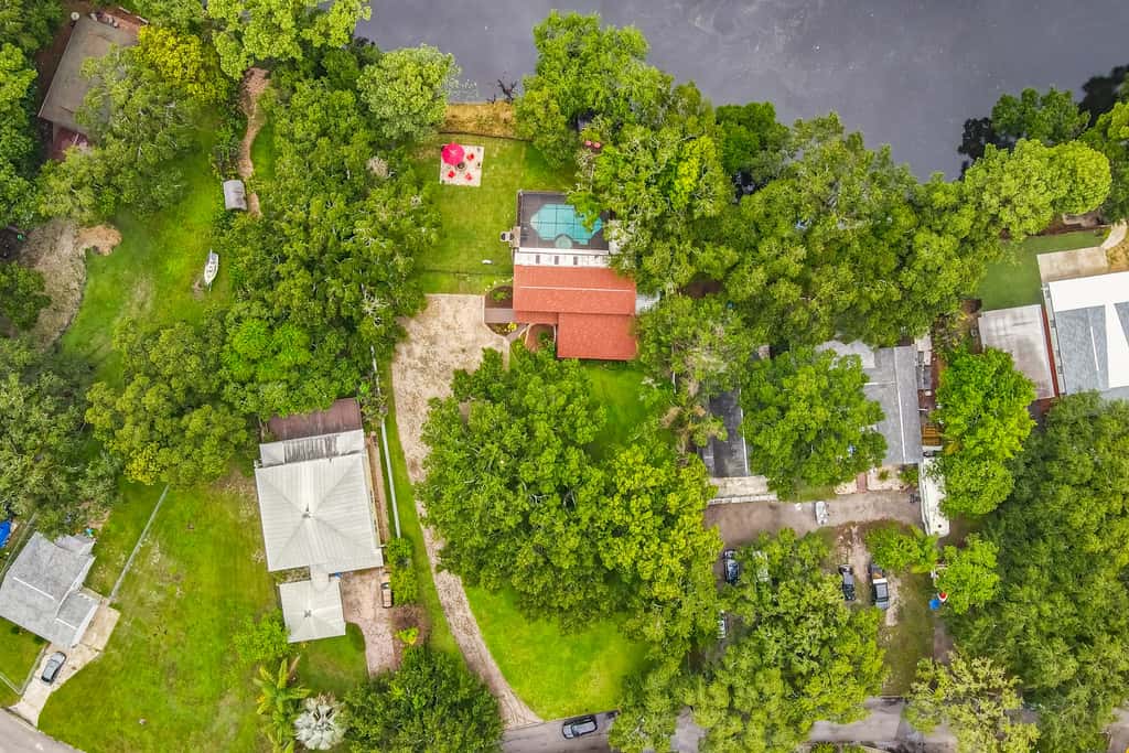 Riverfront retreat with pool spa outdoor kitchen firepit dock sauna and games