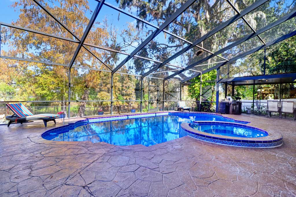 Riverfront retreat with pool spa outdoor kitchen firepit dock sauna and games