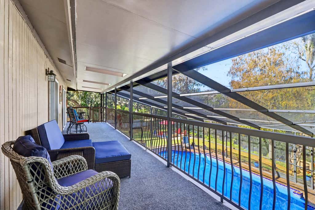 Riverfront retreat with pool spa outdoor kitchen firepit dock sauna and games