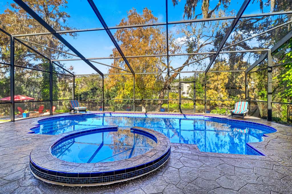 Riverfront retreat with pool spa outdoor kitchen firepit dock sauna and games
