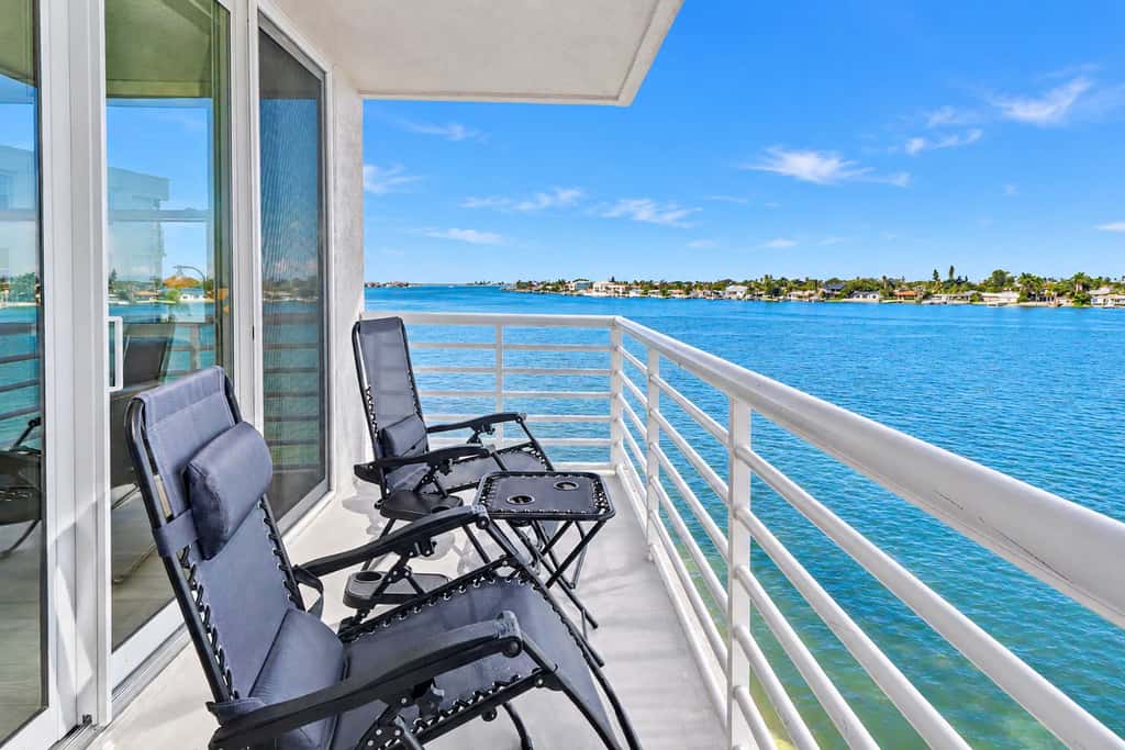 Water view condo with private beach pool and hot tub snowbird friendly