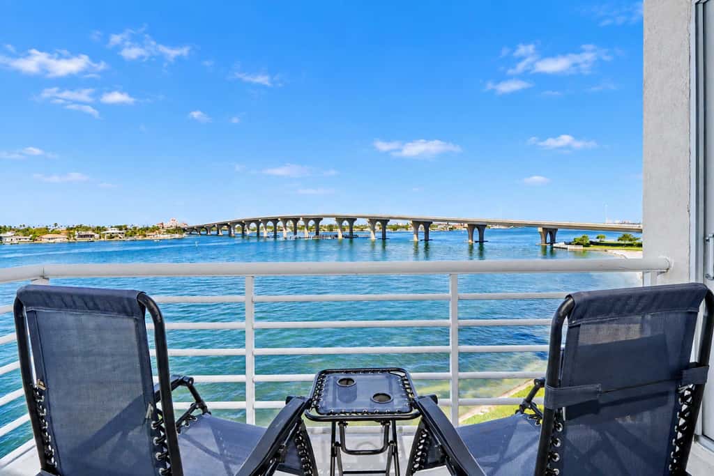 Water view condo with private beach pool and hot tub snowbird friendly