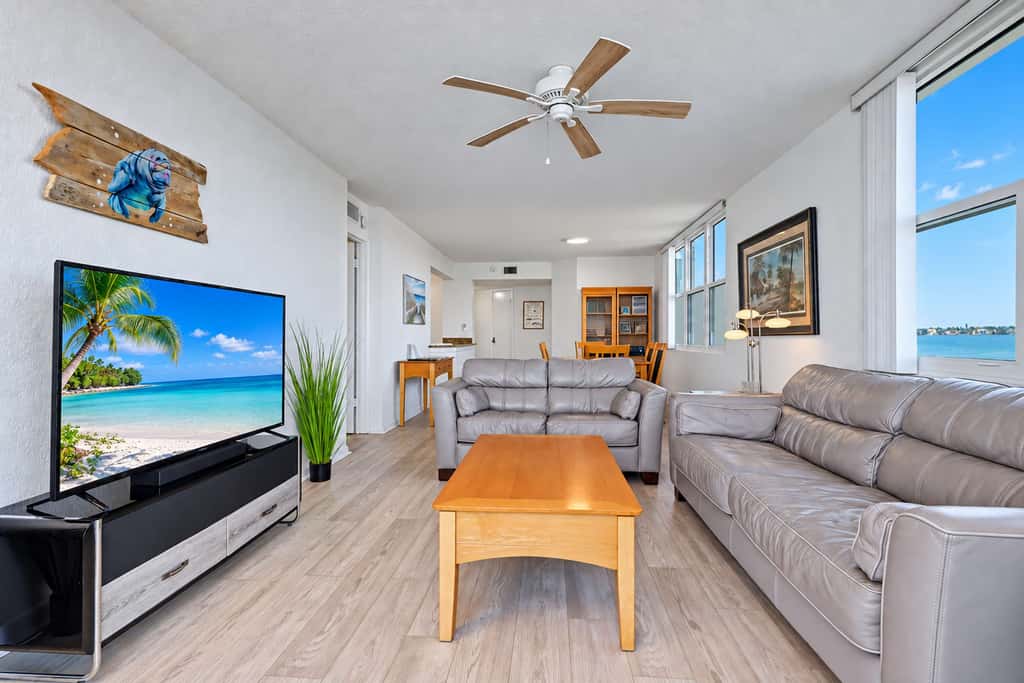 Water view condo with private beach pool and hot tub snowbird friendly