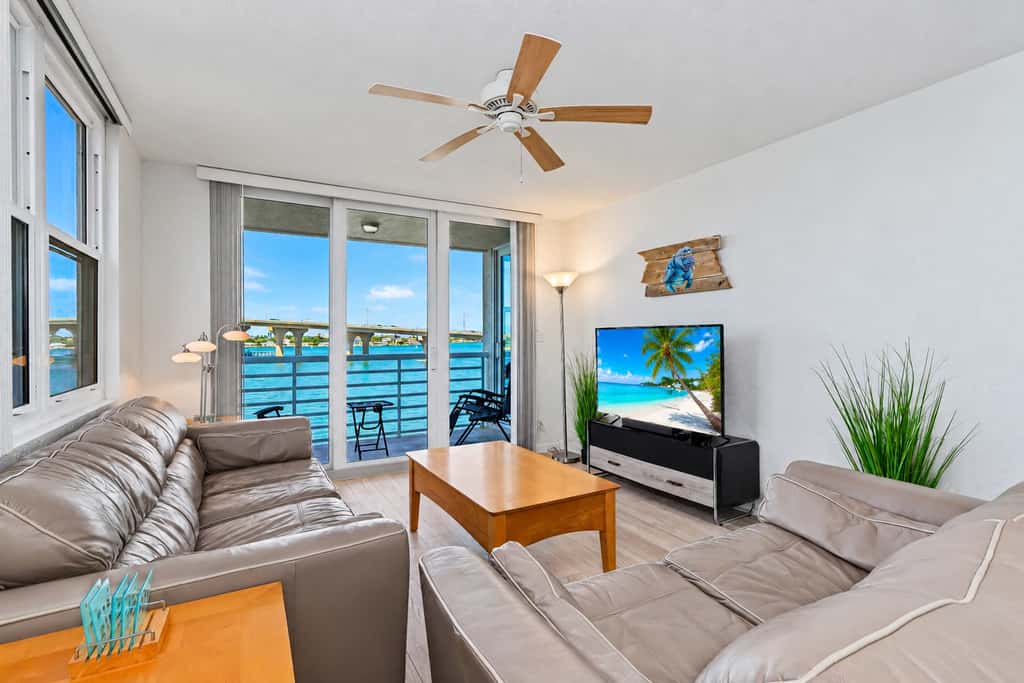 Water view condo with private beach pool and hot tub snowbird friendly